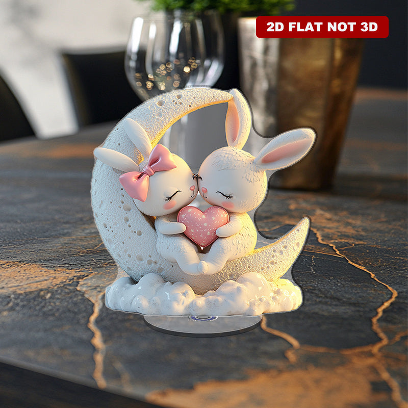 2D Flat, 2D Flat Style, 1pc 2D Rotating Acrylic Desktop Ornament Featuring a Pair of Cute Rabbits with Glowing White Fur, Surrounded by Hearts and Colorful Decorations, Placed on a Moon-shaped House Design, Perfectly Enhancing the Living Room